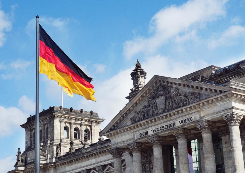 Germany's Reichstag parliament building and the German flag